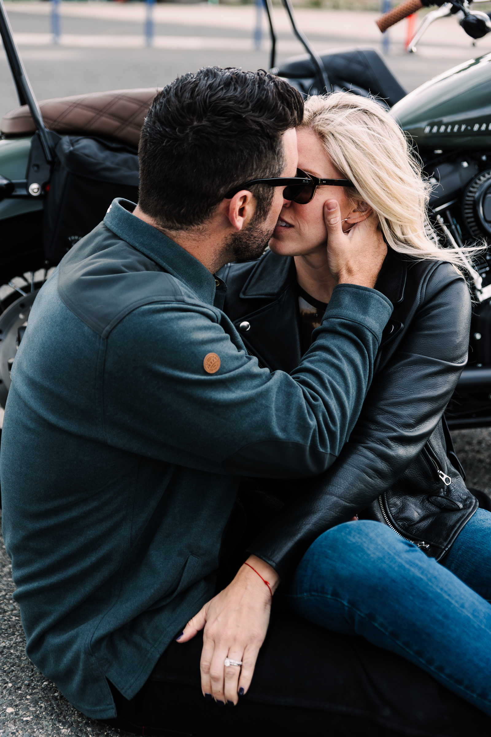 Close-up of couple resting on a motorcycle handlebar, symbolizing connection and adventure in this anniversary couples photoshoot